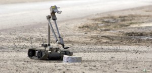 041103-N-4614W-033 Samarra, Iraq (Nov. 3, 2004) - A U.S. Army explosive ordnance disposal (EOD) robot, Òi-RobotÓ, pulls the wire of an alleged improvised explosive device (IED), found by the Iraqi Police. Controlled by a team of Soldiers assigned to 731st Ordnance Company, of Wright-Patterson Air Force Base, Ohio, Òi-RobotÓ safely surveys the device at a safe distance with its two on-board cameras and mechanical arm. U.S. Navy photo by Journalist 1st Class Jeremy L. Wood (RELEASED)